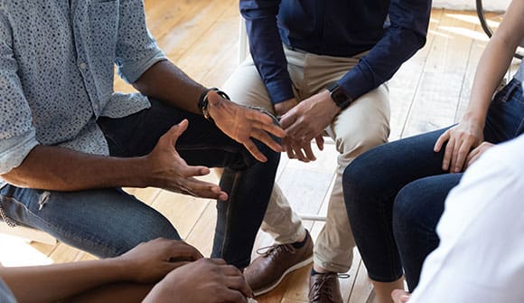 African man counselor speak at group counseling therapy session