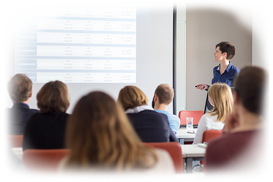 Female speaker giving presentation in lecture hall at university workshop