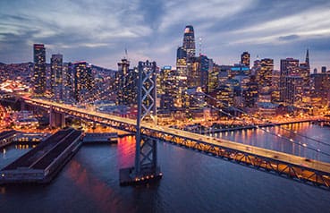 Aerial cityscape view of San Francisco and the Bay Bridge at Night