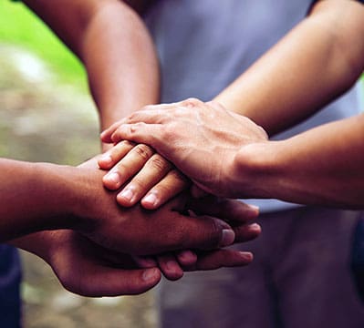 Solidarity unite people hands together community teamwork. Hands of spirit team working together outdoor